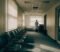a gp partner alone in a surgery building illustrating the last man standing risk in practice ownership a gp partner alone in a surgery building illustrating the last man standing risk in practice ownership