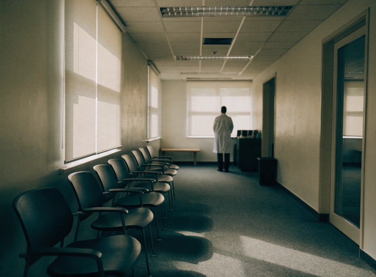 a gp partner alone in a surgery building illustrating the last man standing risk in practice ownership