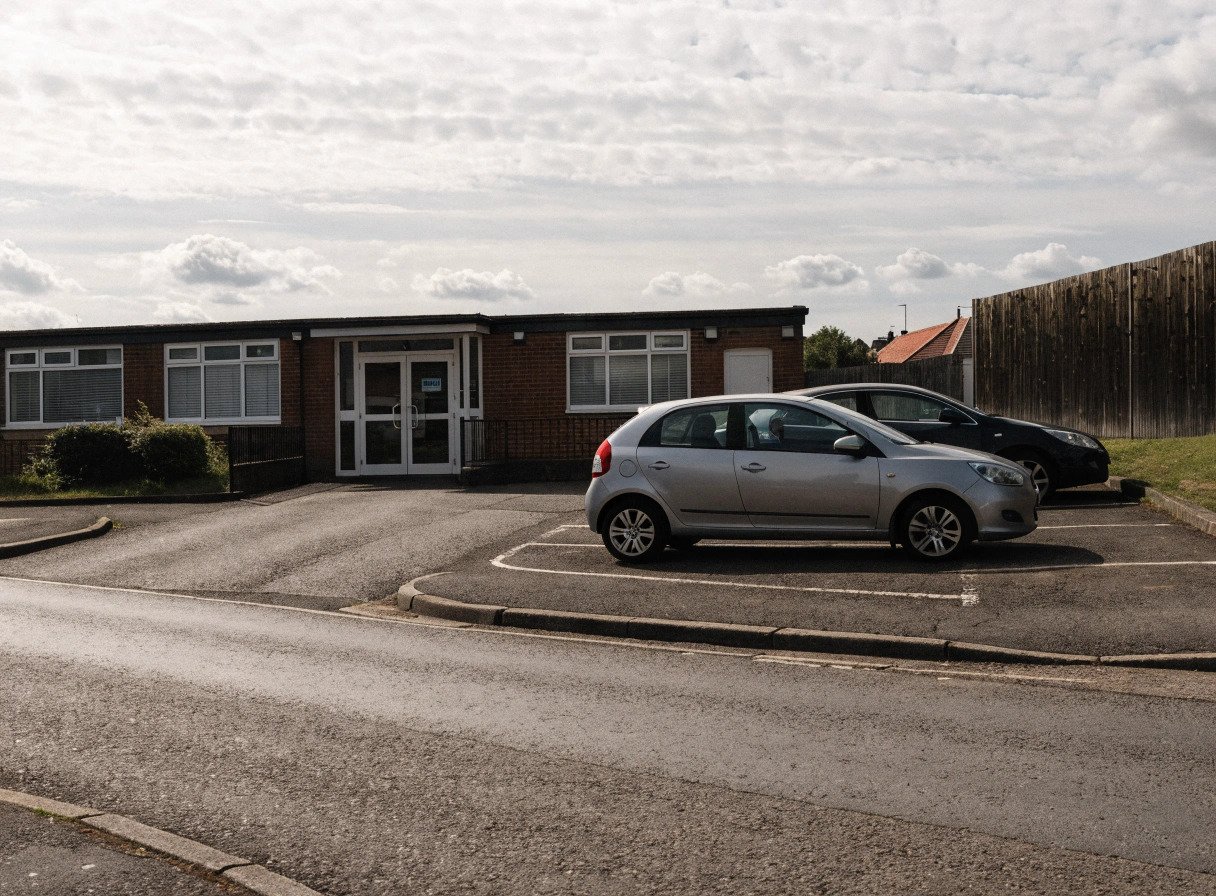exterior of a uk gp surgery building relevant to nhs property service charge disputes