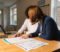 gp partner and practice manager reviewing a disputed nhs property services invoice gp partner and practice manager reviewing a disputed nhs property services invoice