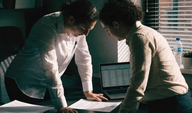 gp partner and practice manager reviewing the 202627 gp contract changes letter