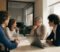 gp partners and practice manager discussing pcn contract options in a surgery meeting room gp partners and practice manager discussing pcn contract options in a surgery meeting room