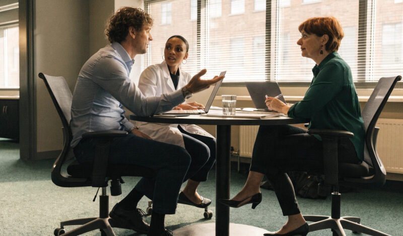 gp, pharmacist and practice manager in a primary care network planning meeting