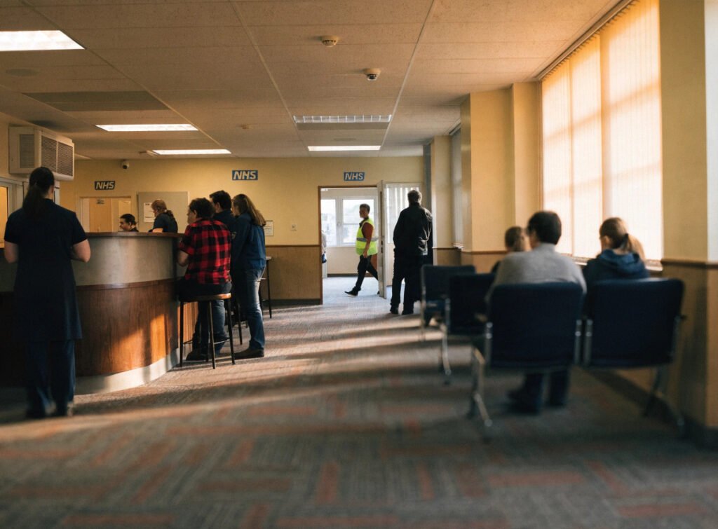 gp surgery reception area representing a practice affected by nhs funding administration