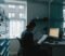 practice manager reviewing data protection officer responsibilities in a gp surgery office