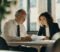 senior gp partner reviewing a partnership deed with a solicitor during a retirement age discussion senior gp partner reviewing a partnership deed with a solicitor during a retirement age discussion