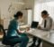 24 hour retirement for nhs dentists explained Dentist and adviser reviewing NHS pension paperwork for 24-hour retirement