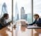 commercial dispute solicitors boardroom meeting Two business owners in a London boardroom discussing a commercial dispute with their solicitor