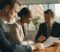 Solicitor reviewing a commercial lease agreement with a landlord and tenant in a London office