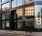 Modern London commercial office building with a To Let board, representing commercial property solicitors advising on acquisitions and lettings