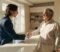 A new dental practice partner shaking hands with the existing owner after completing a buy-in