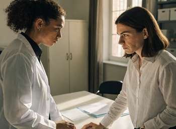 Two dental practice partners in a difficult discussion over a partnership dispute