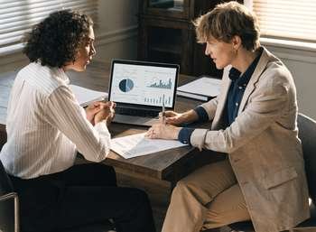 Dental practice owner reviewing a valuation report with an adviser