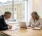 Business owner and accountant reviewing company accounts together in a London meeting room