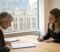 business owner and solicitor reviewing a business sale agreement in a london meeting room Business owner and solicitor reviewing a business sale agreement in a London meeting room